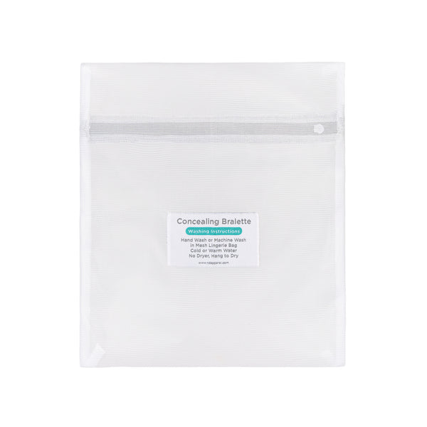 Empty white mesh wash bag for delicates featuring a centered care instruction label for washing concealing bralettes.