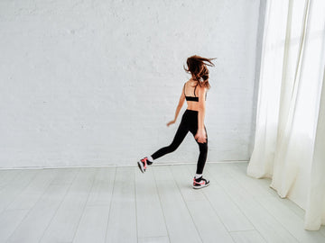 adorable tween dancing in a black bralette and jeans