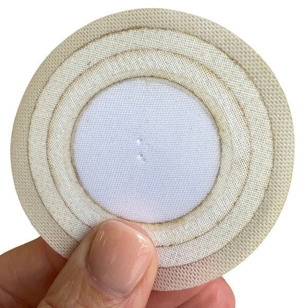 nipple concealing pad being held up