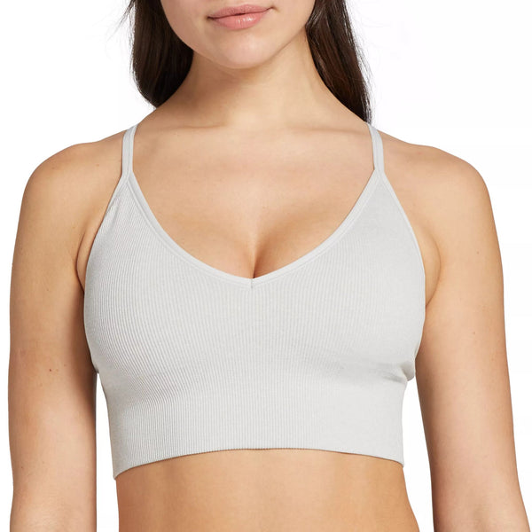 Dicks Sporting Goods ribbed sports bra on model showing an brand option for nipple concealing petal service.